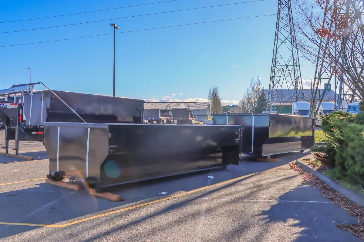 Roll-off dumpster ready for waste disposal at job site for Yard Waste Dumpster Rental in Greenwood